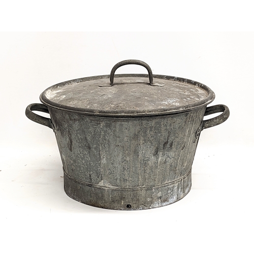 256 - A vintage galvanized two handled basin with lid. 49x34cm