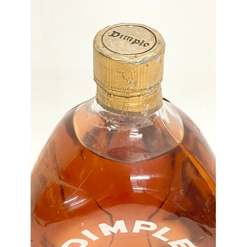 154 - A vintage Haig’s Dimple Whisky. 20.5cm