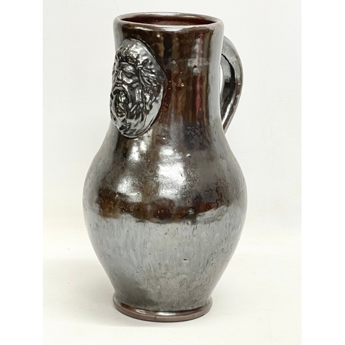 845 - A large vintage salt glazed pottery jug. 21x30cm.