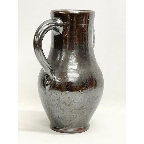 845 - A large vintage salt glazed pottery jug. 21x30cm.