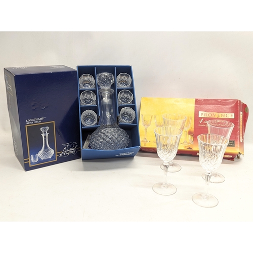 836 - A crystal decanter with 6 drinking glasses with a set of 4 sherry glasses.