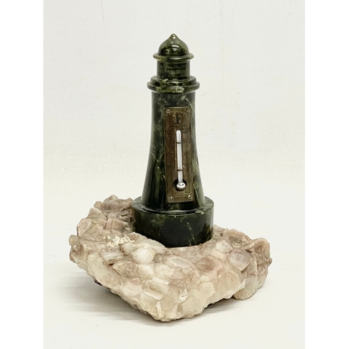 A vintage marble lighthouse barometer on stone base. 10x13cm.