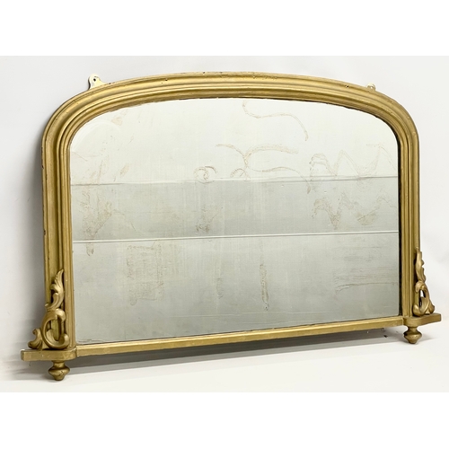 21 - A Victorian gilt framed overmantle mirror. 111x71cm.