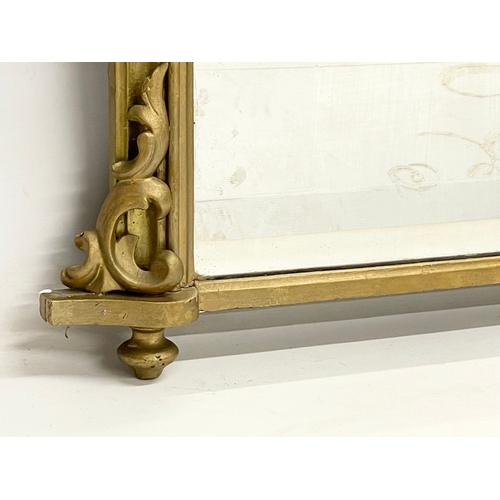 21 - A Victorian gilt framed overmantle mirror. 111x71cm.