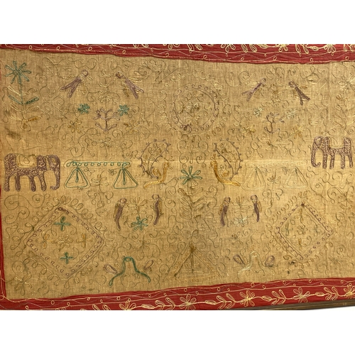 74 - A large early 20th century framed Indian silk. 119x81cm.