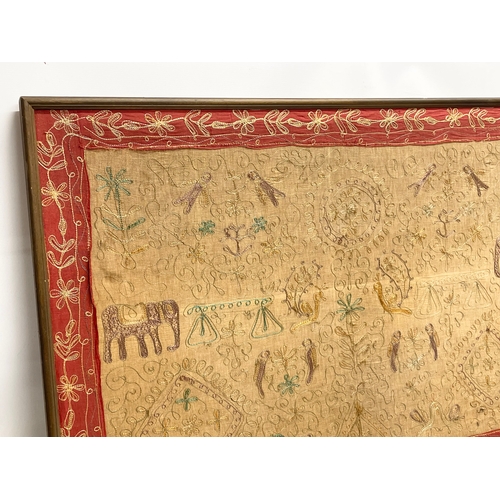 74 - A large early 20th century framed Indian silk. 119x81cm.