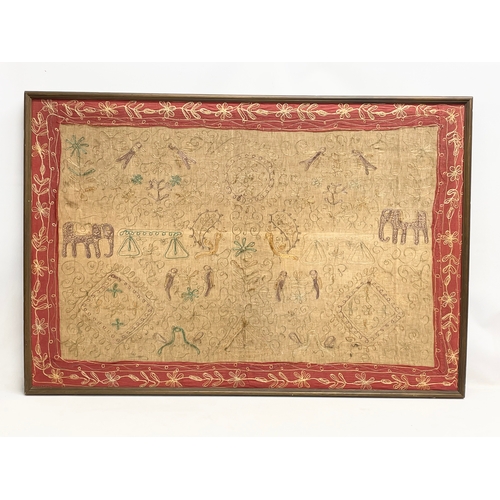 74 - A large early 20th century framed Indian silk. 119x81cm.