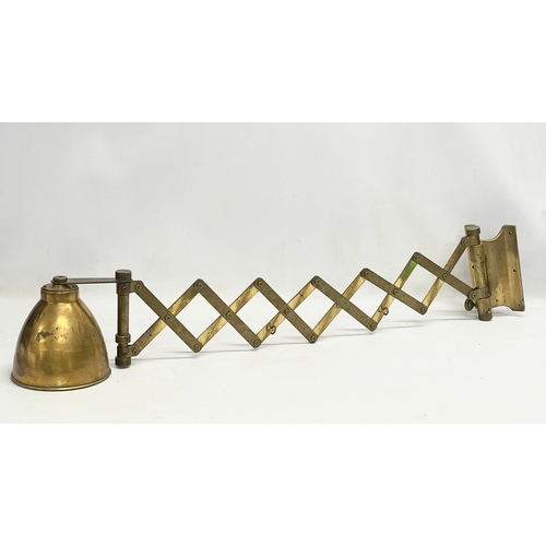 56 - A large vintage brass wall scissor spring lamp. Full extended 97cm. Closed 30cm