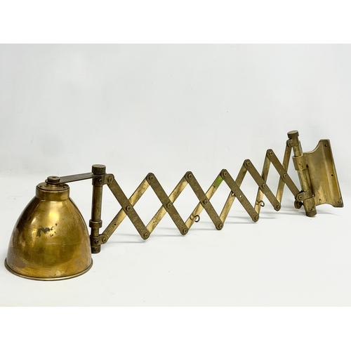 56 - A large vintage brass wall scissor spring lamp. Full extended 97cm. Closed 30cm