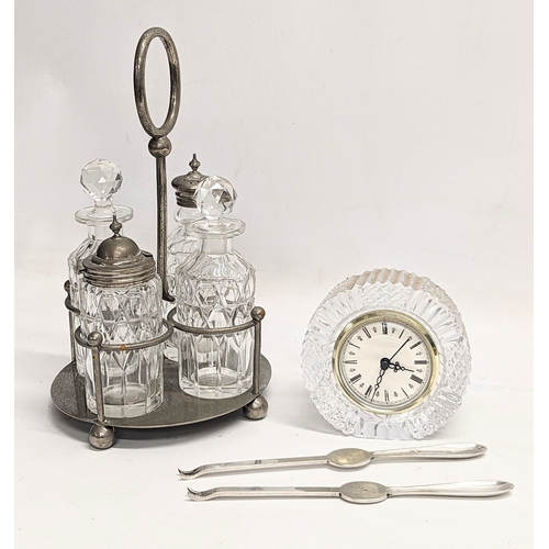 828 - A sundry lot. Including a Tyrone Crystal mantle clock, a vintage cruet set and a pair of silver plat... 