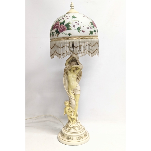 826 - A vintage ornate table lamp. 74cm