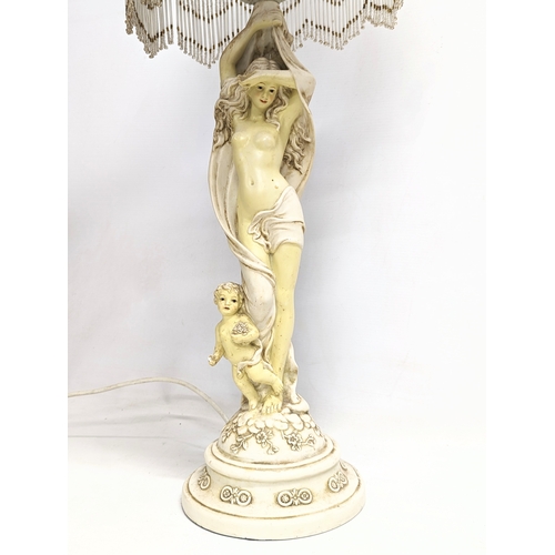 826 - A vintage ornate table lamp. 74cm