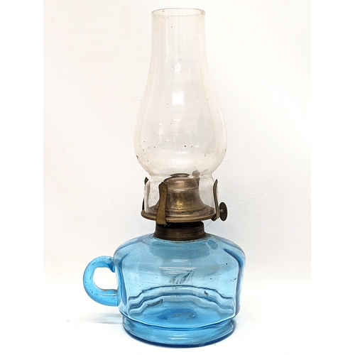 183 - A Victorian glass finger oil lamp. 27cm