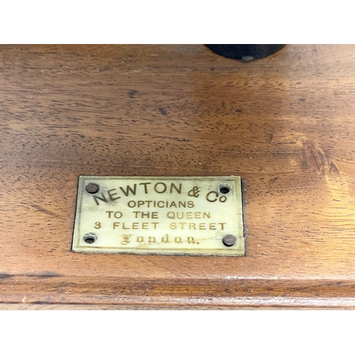 59 - An early 20th century vacuum pump by Newton & Co, Fleet Street London. 33x18x28cm.