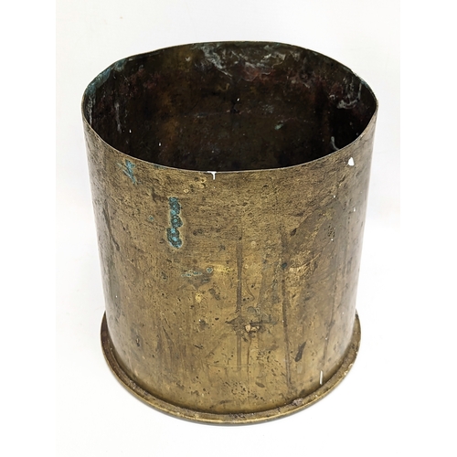 103 - A large brass World War I Trench Art canon shell, dated September 1917. 22x23cm