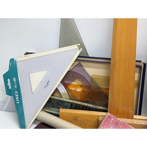 106 - A quantity of vintage architectural equipment, including tracing paper, rulers, etc.