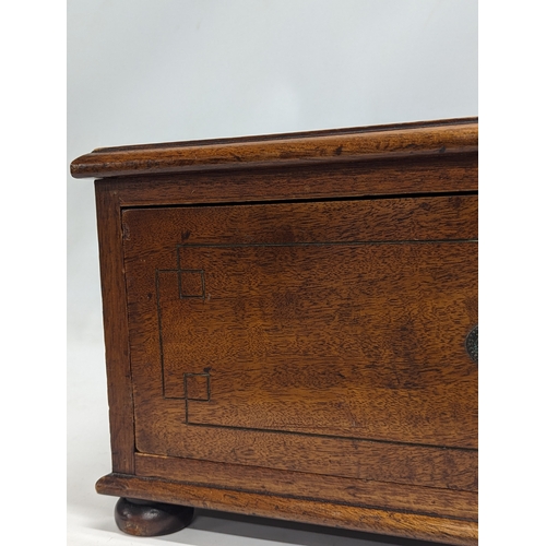 108 - A late Victorian mahogany table top chest, with key. 49.5x33x20.5cm