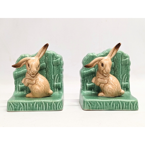 686 - A pair of Sylvac pottery bookends. 11x11cm
