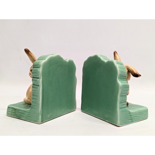 686 - A pair of Sylvac pottery bookends. 11x11cm