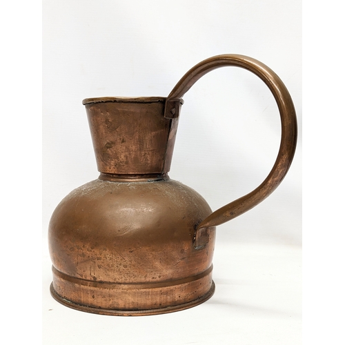 116 - An early 20th century copper jug. 28x25cm