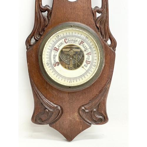 130 - A late Victorian barometer. 58cm