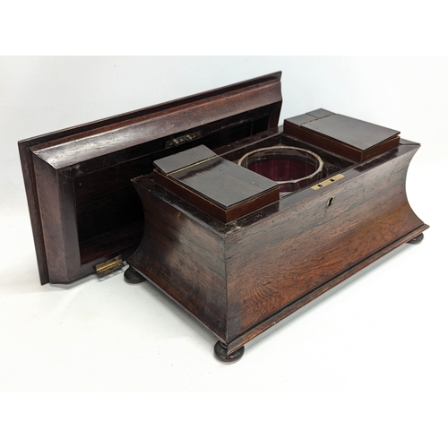 35 - A large Regency rosewood tea caddy in sarcophagus shape, circa 1810. 37x21.5x22.5cm