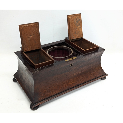 35 - A large Regency rosewood tea caddy in sarcophagus shape, circa 1810. 37x21.5x22.5cm