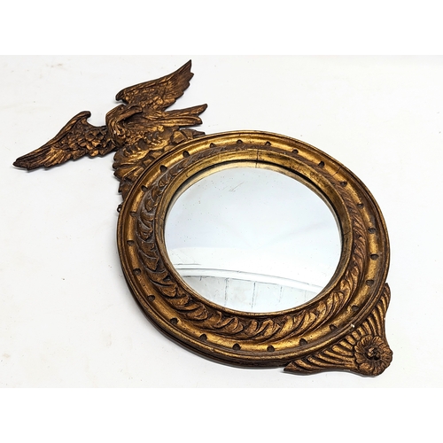 33 - An Edwardian Regency style gilt framed convex mirror. 36.5x58cmn