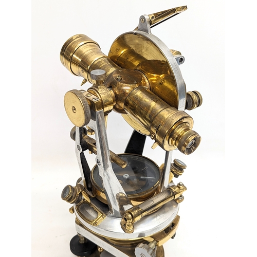 27 - An early 20th century brass Theodolite with compass and spirit levels. 22x36.5cm