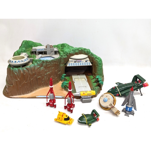 325E - A vintage Thunderbirds model toy set with accessories, etc.