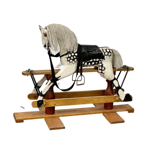 118 - A vintage wooden rocking horse. 119x91cm