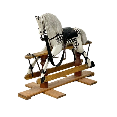 118 - A vintage wooden rocking horse. 119x91cm