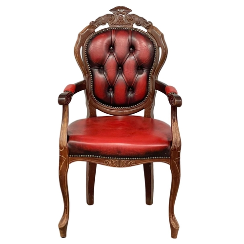 249 - An ox-blood leather Italian style chair.