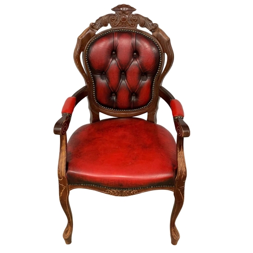 249 - An ox-blood leather Italian style chair.