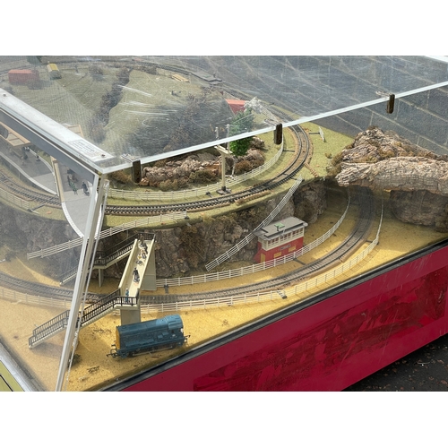 60A - A large Hornby Railways train set in display case. 158x116x64cm.