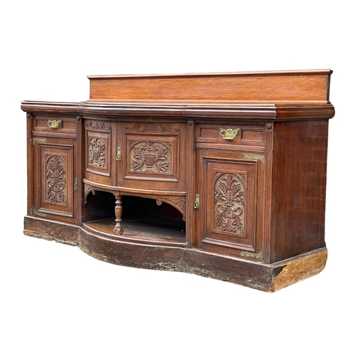 1626 - A large late Victorian oak sideboard. Circa 1890. 214x79x120cm