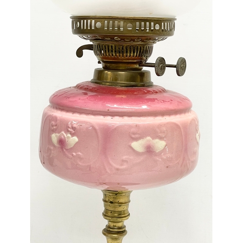 1 - A tall Victorian double burner oil lamp. 61.5cm