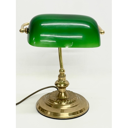 9 - A brass desk lamp with glass shade. 28x35cm