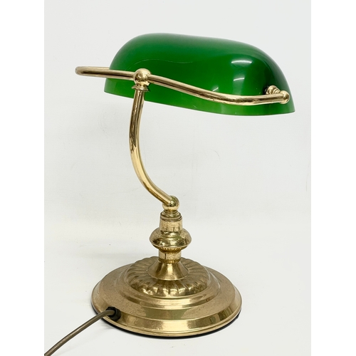 9 - A brass desk lamp with glass shade. 28x35cm