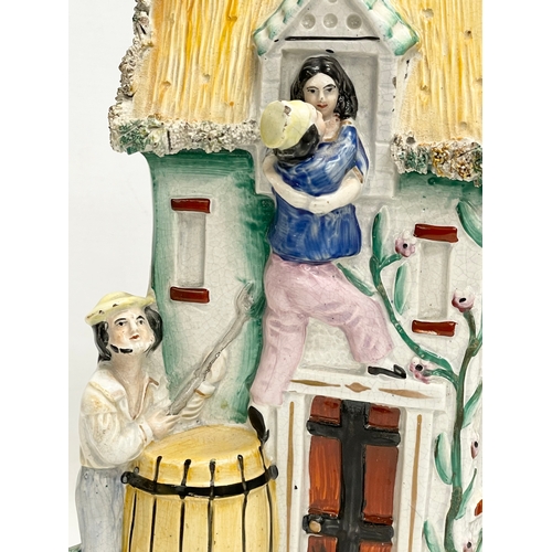 12 - A 19th century Staffordshire Pottery ‘Courting Under Difficulties’ figure. 20x31cm.