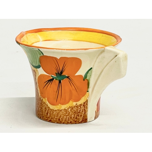 28 - A 1920’s Clarice Cliff Bizarre Nasturtium milk jug. Art Deco. 11x8x6cm.