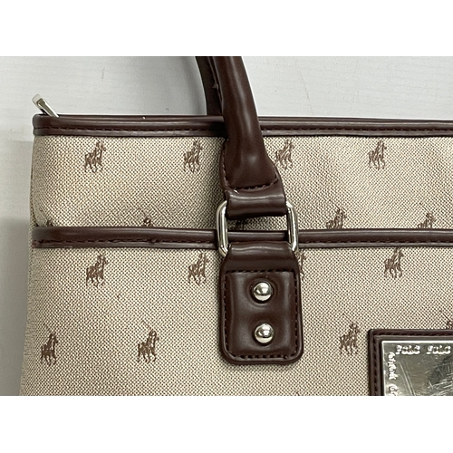 521 - A Ralph Lauren Polo handbag. 37cm