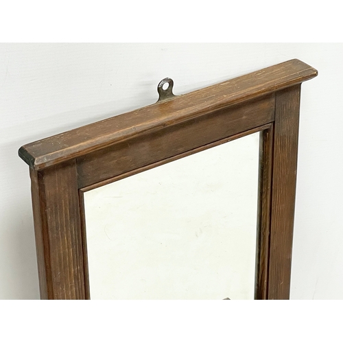 136 - A Victorian gents shaving mirror. 31x44cm.