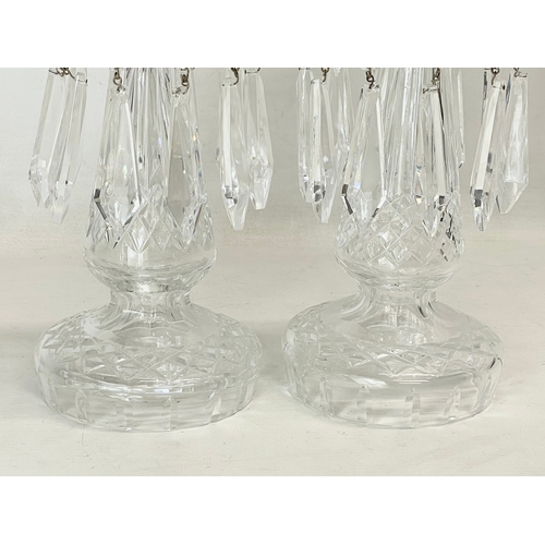 41 - A pair of vintage Waterford Crystal lustre candleholders with droplets. 25cm