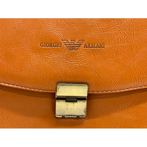 404 - A leather Giorgio Armani briefcase. 43x34cm