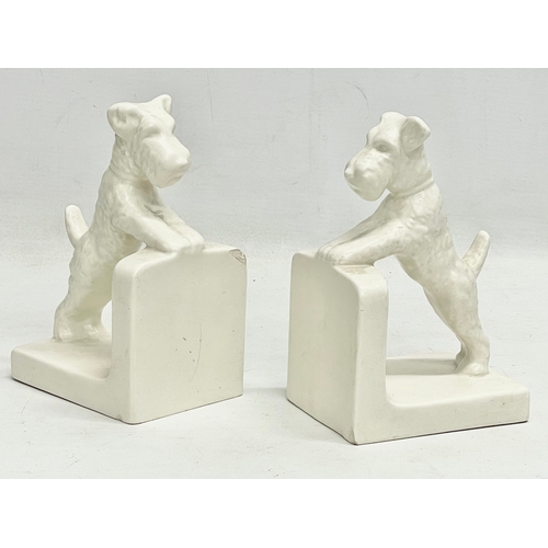 145 - A pair of 1950’s Hummel pottery bookends. 8x11x16cm.