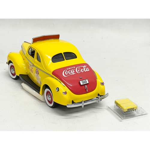 199 - A Danbury Mint Coca Cola 1940 Salesman’s Car in box. Box measures 27x14x12cm.