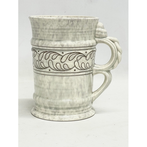 261 - A 1930’s Charlotte Rhead pottery jug. Designed for Crown Ducal. 19x19cm.