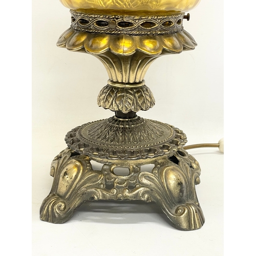 270 - A large ornate brass Falkenstein table lamp. 63cm