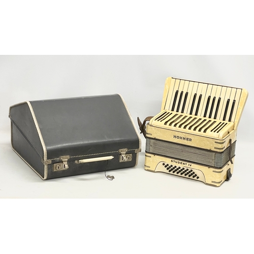 204 - A Hohner Student IV accordion in case.